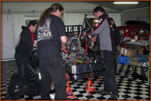 The Trouble Racing crew preparing to get things fixed